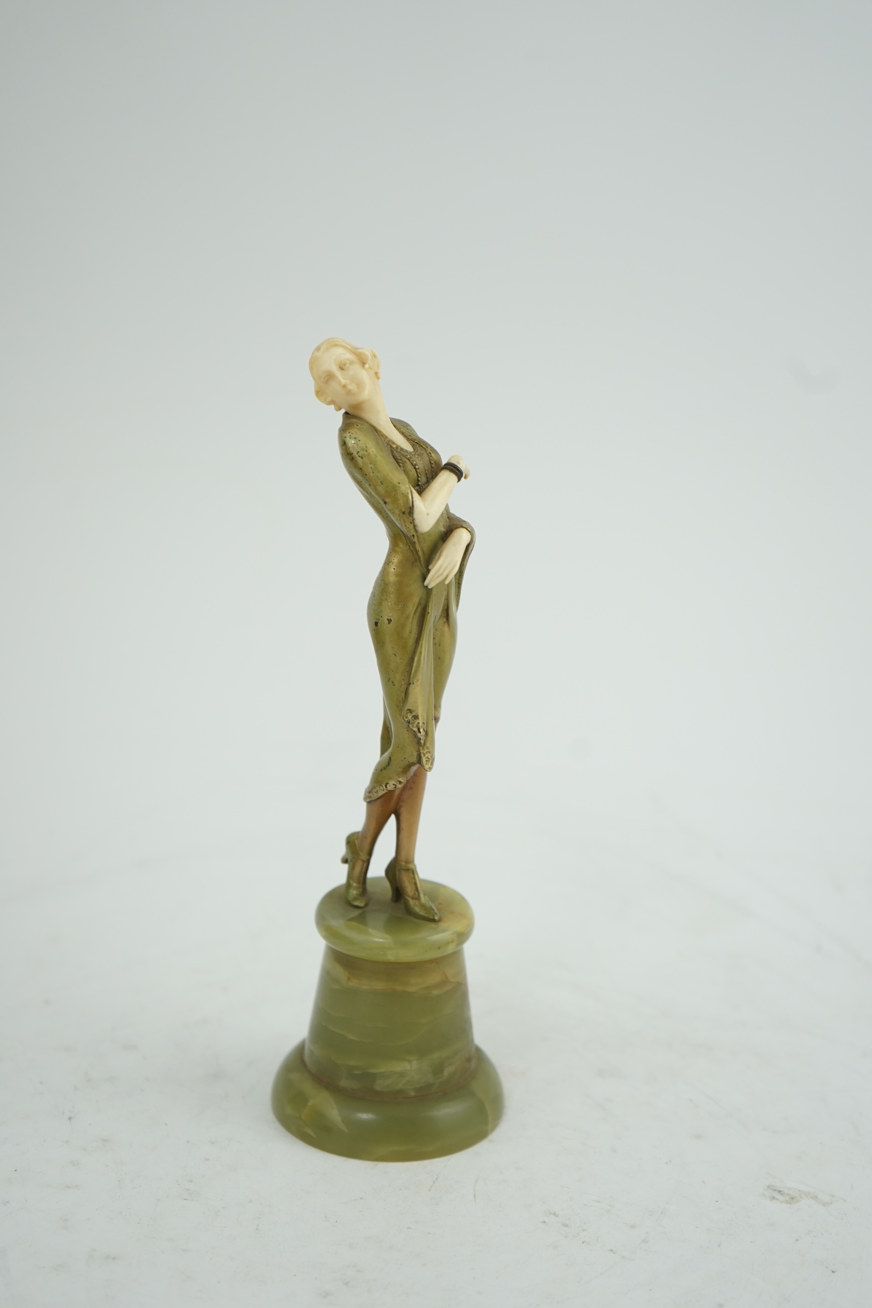 Attributed to Josef Lorenzl. An Art Deco bronze and ivory figure of a stylish lady